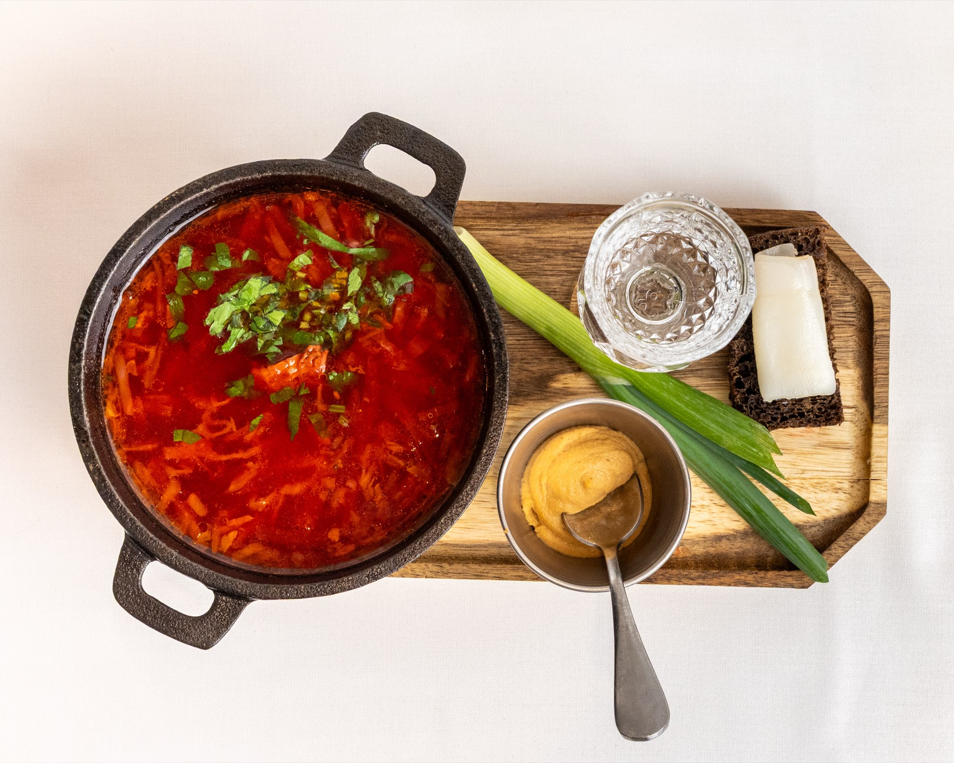 Classic Ukrainian borscht with sour cream and fresh herbs