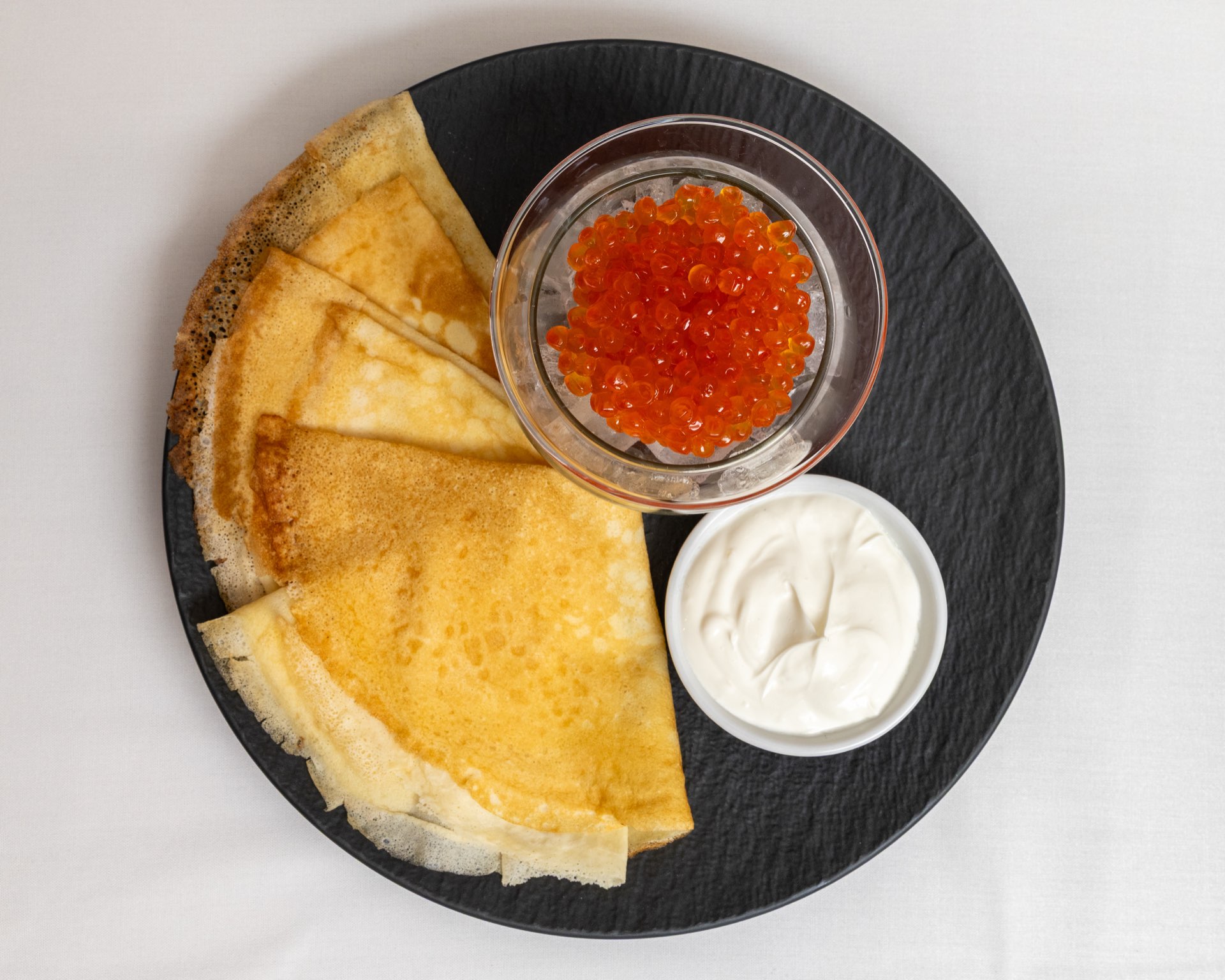 Blini with red caviar